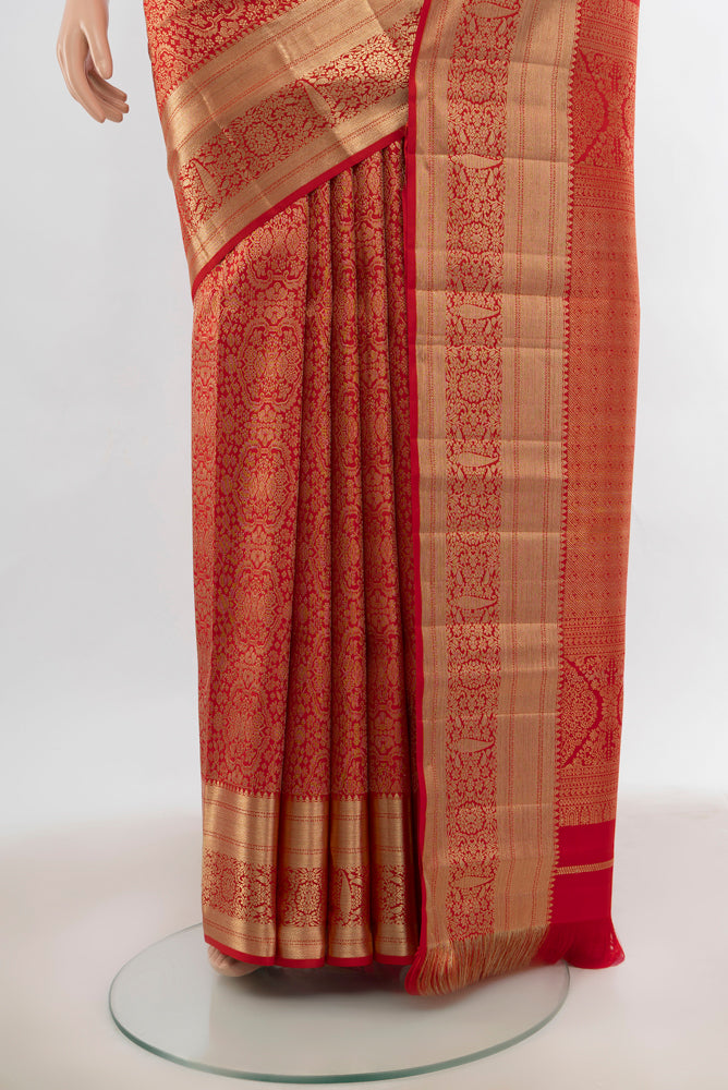 Pleats and pallu of Red Kanjivaram Silk Saree with Zari Butta on the body and Silk Border. 