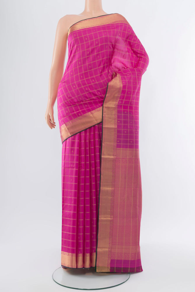 Rose pink Kanchipuram Silk Saree with Zari Butta on the body and Silk Border.  displayed on a mannequin