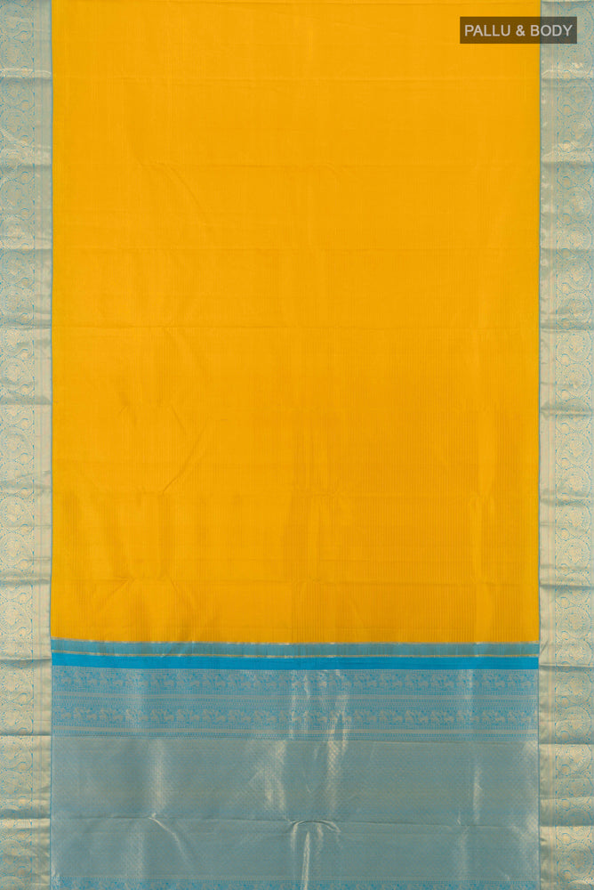 Flat view of Yellow Kanchipuram Silk Saree with Zari Butta on the body and Silk Border. 