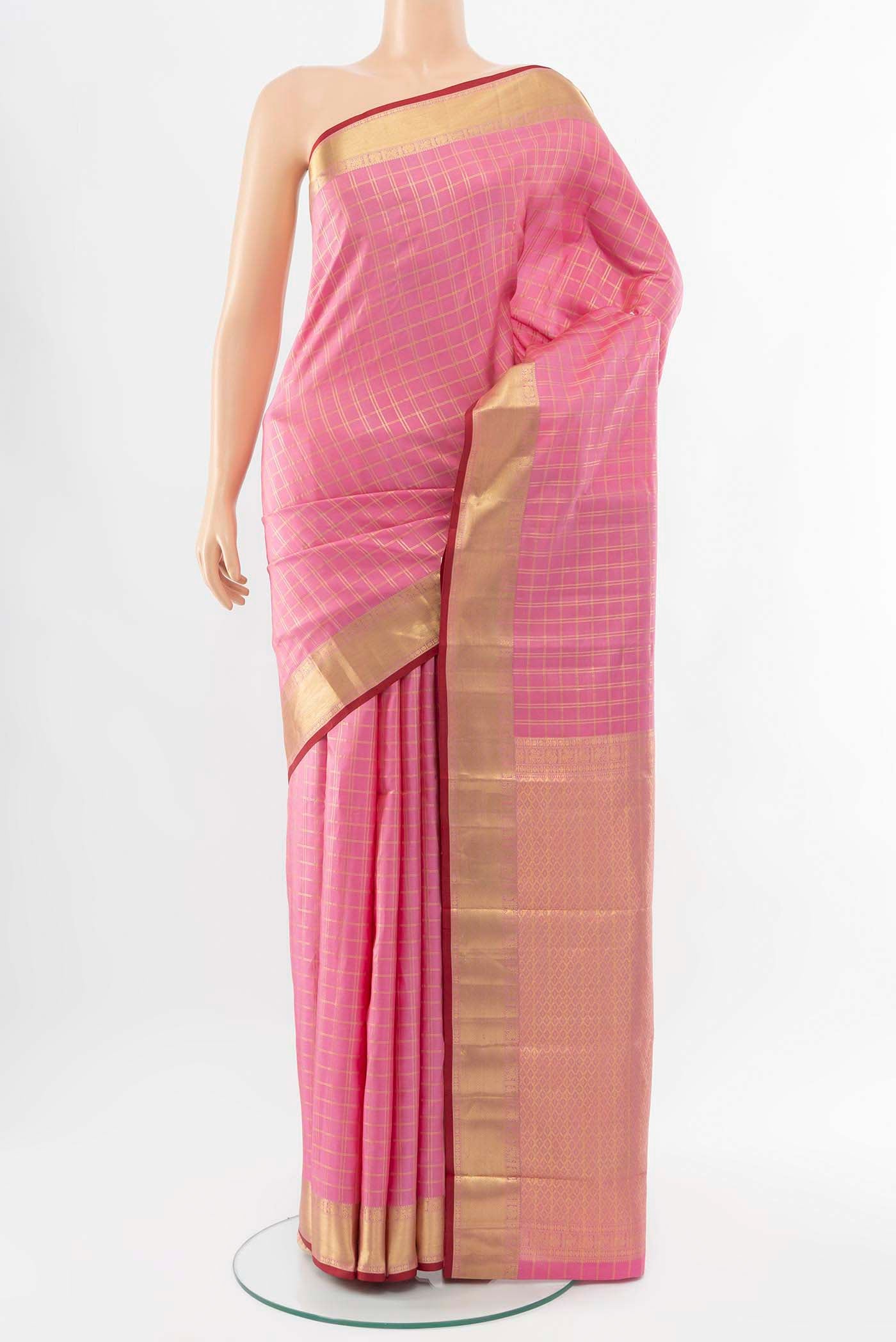 Rose pink Kanchipuram Silk Saree with Checked design on the body and Zari Border displayed on a mannequin