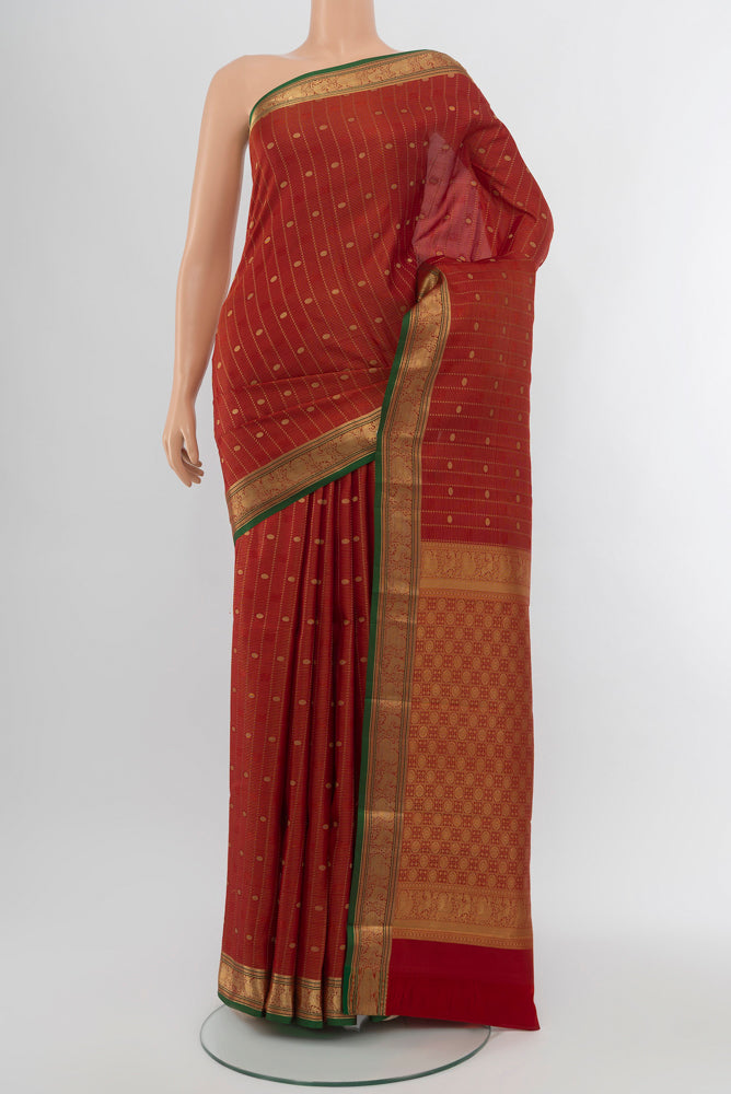 Maroon Kanchipuram Silk Saree with Zari Butta on the body and Silk Border.  displayed on a mannequin