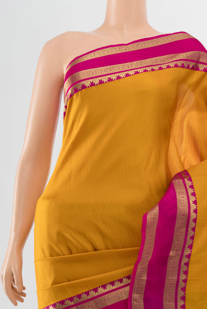 Border image of Mustard Kanchipuram Silk Saree with Zari Butta on the body and Silk Border. 