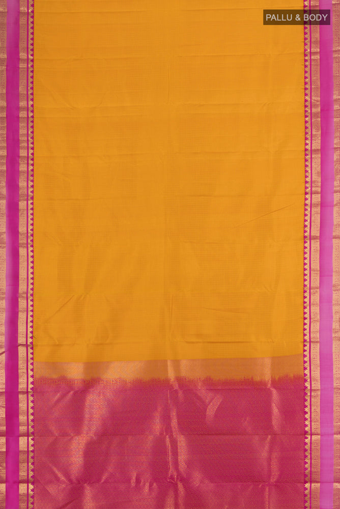Flat view of Mustard Kanchipuram Silk Saree with Zari Butta on the body and Silk Border. 