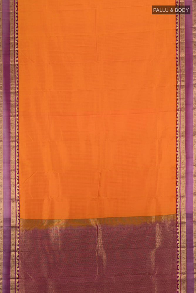 Flat view of Brick Orange Kanchipuram Silk Saree with Zari Butta on the body and Silk Border. 