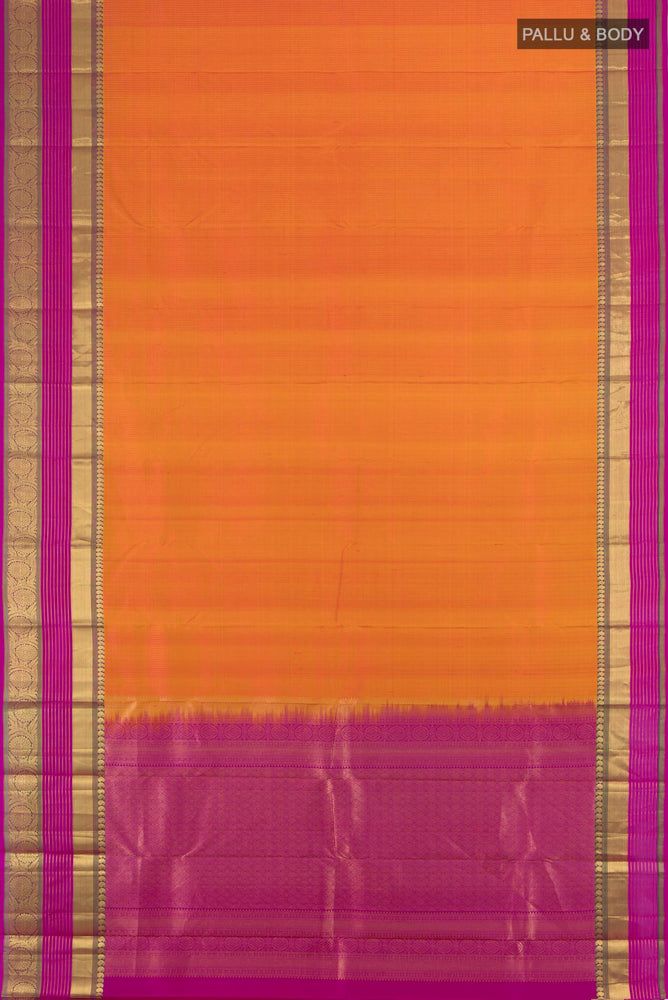 Flat view of Golden Peach Kanjivaram Silk Saree with Zari Butta on the body and Silk Border. 