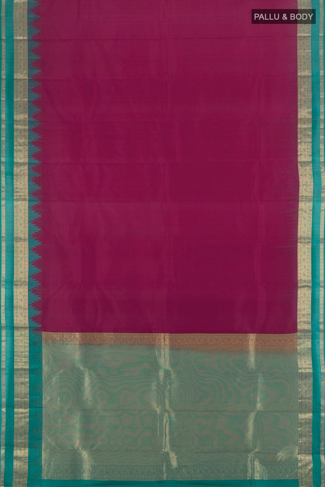 Flat view of Maroon Kanchipuram Silk Saree with Zari Butta on the body and Silk Border. 