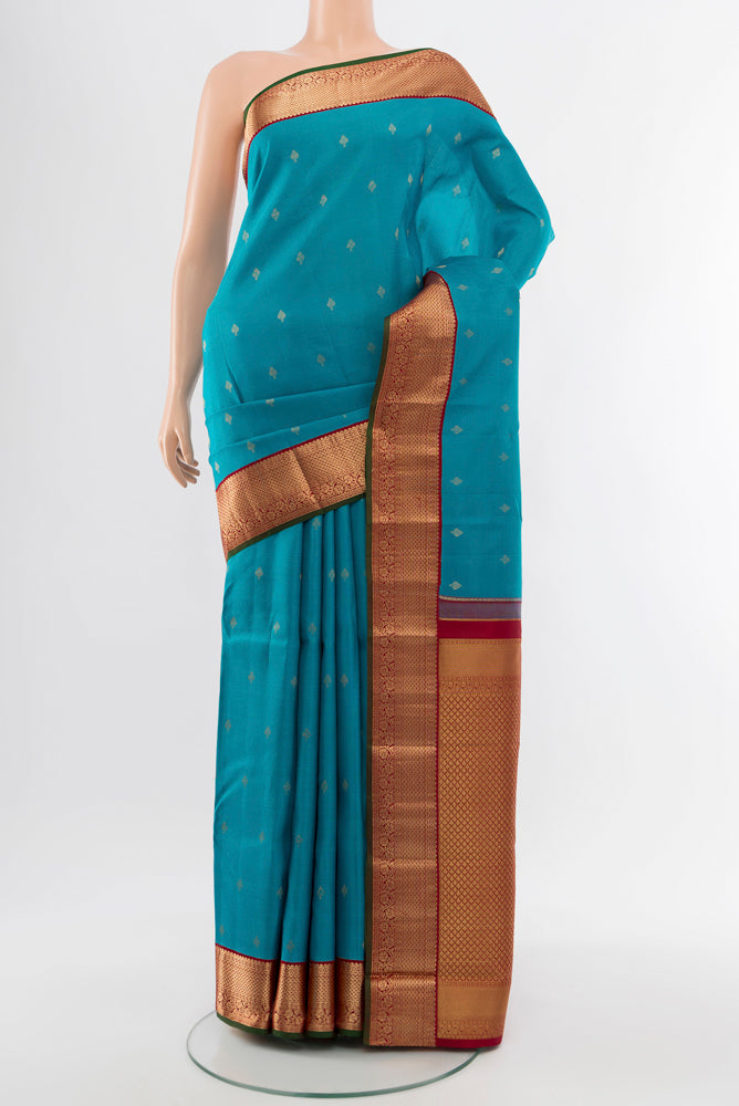 Light Blue Kanchipuram Silk Saree with Zari Butta on the body and Silk Border.  displayed on a mannequin