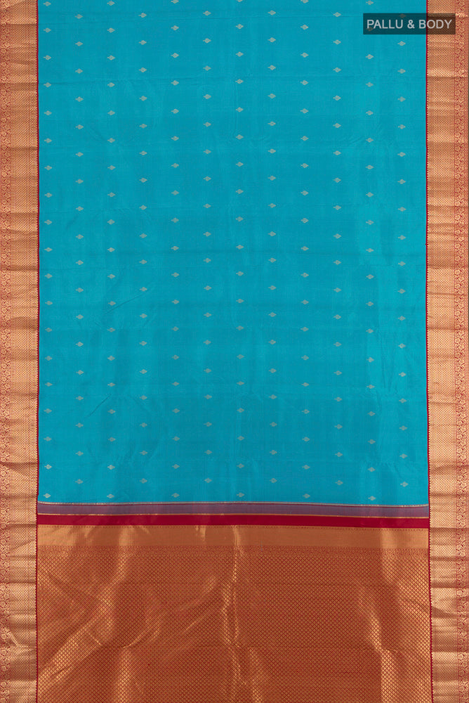 Flat view of Light Blue Kanchipuram Silk Saree with Zari Butta on the body and Silk Border. 