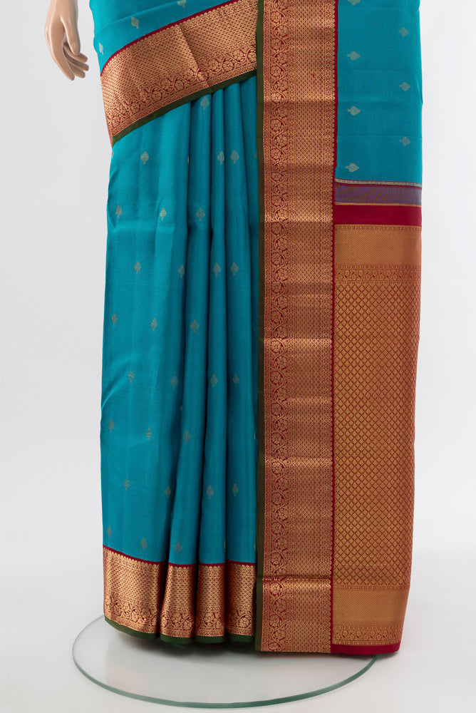 Pleats and pallu of Light Blue Kanchipuram Silk Saree with Zari Butta on the body and Silk Border. 