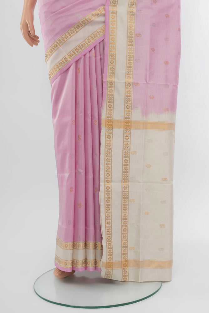 Pleats and pallu of Rose pink Uppada Silk Saree with Zari Butta on the body and Zari Border. 