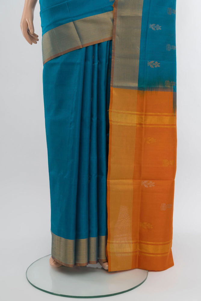Pleats and pallu of Dark Blue Uppada Silk Saree with Zari Butta on the body and Zari Border. 