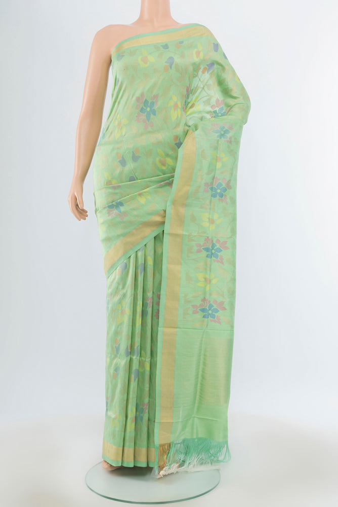 Pure Silk Pure Zari Pista Green Uppada Saree with Zari Butta on the body and Silk Border.  displayed on a mannequin