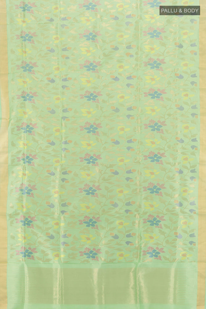 Flat view of Pure Silk Pure Zari Pista Green Uppada Saree with Zari Butta on the body and Silk Border. 