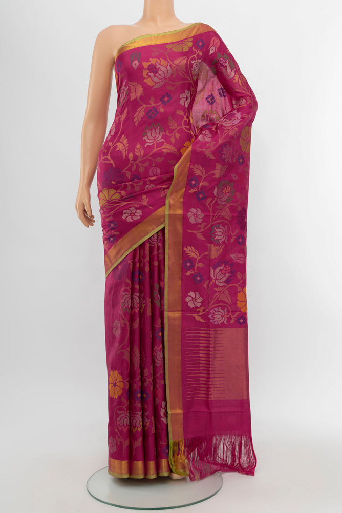 Magenta Uppada Silk Saree with Zari Butta on the body and Silk Border.  displayed on a mannequin