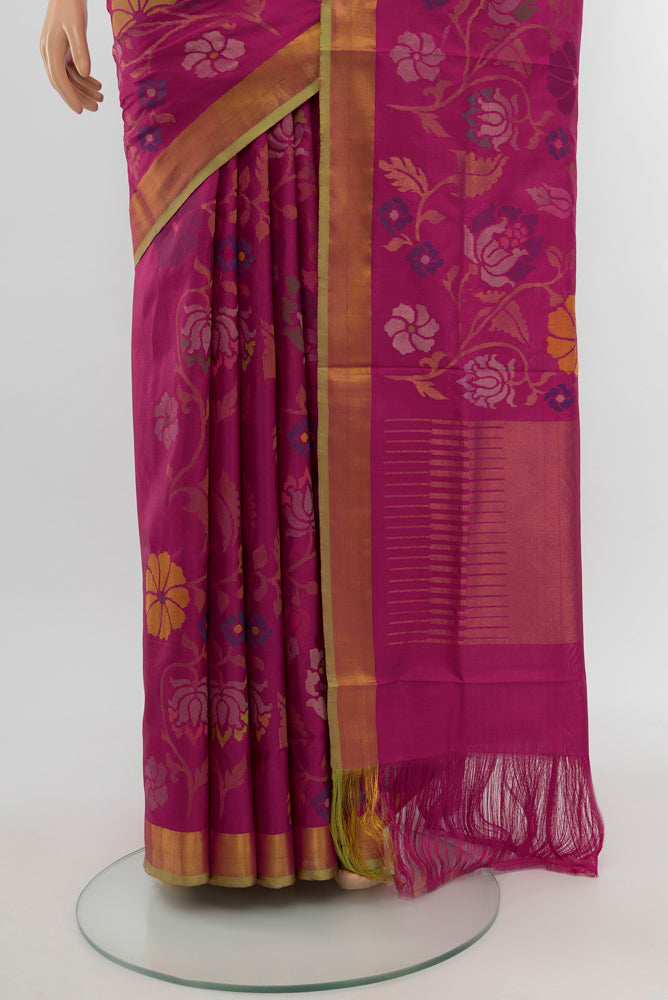 Pleats and pallu of Magenta Uppada Silk Saree with Zari Butta on the body and Silk Border. 