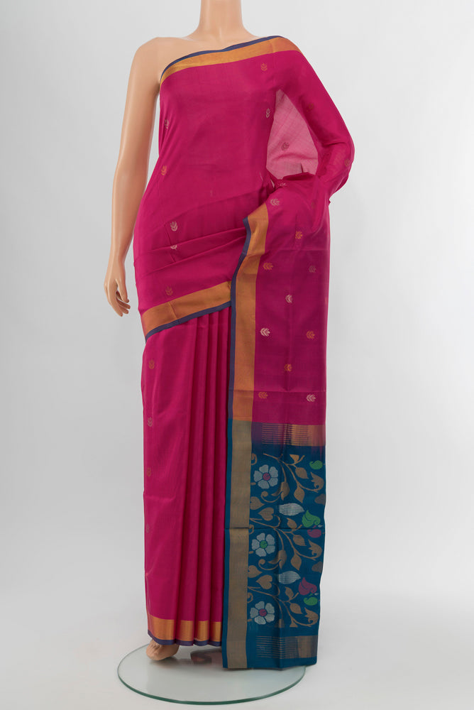 Dark Pink Uppada Silk Saree with Zari Butta on the body and Silk Border.  displayed on a mannequin