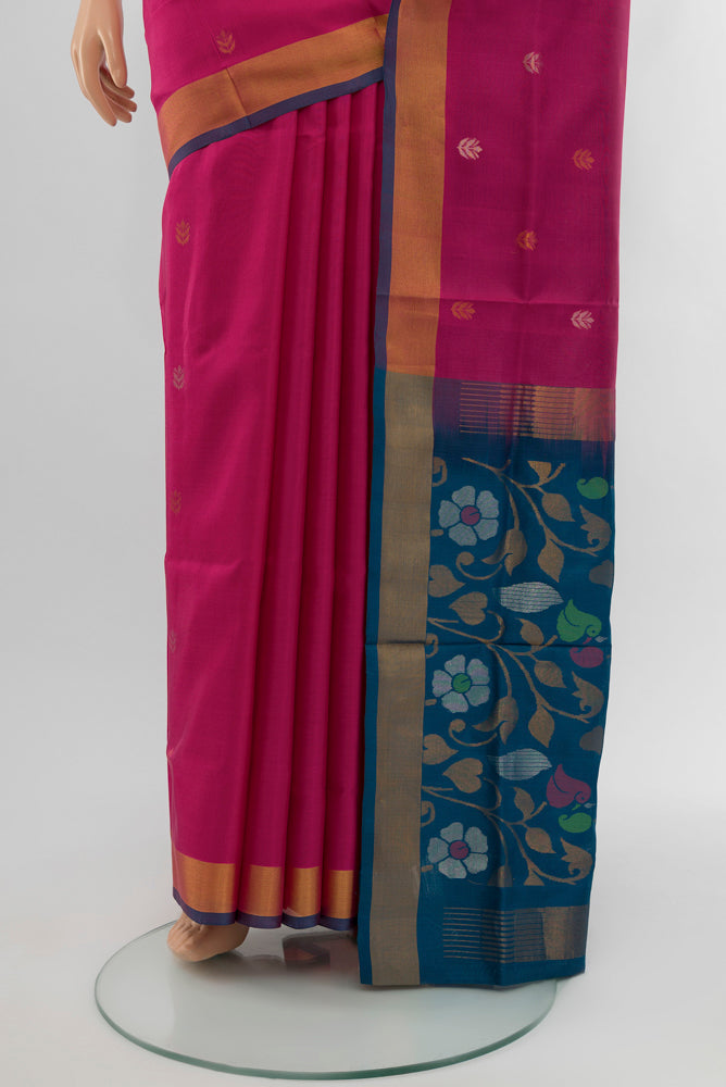 Pleats and pallu of Dark Pink Uppada Silk Saree with Zari Butta on the body and Silk Border. 