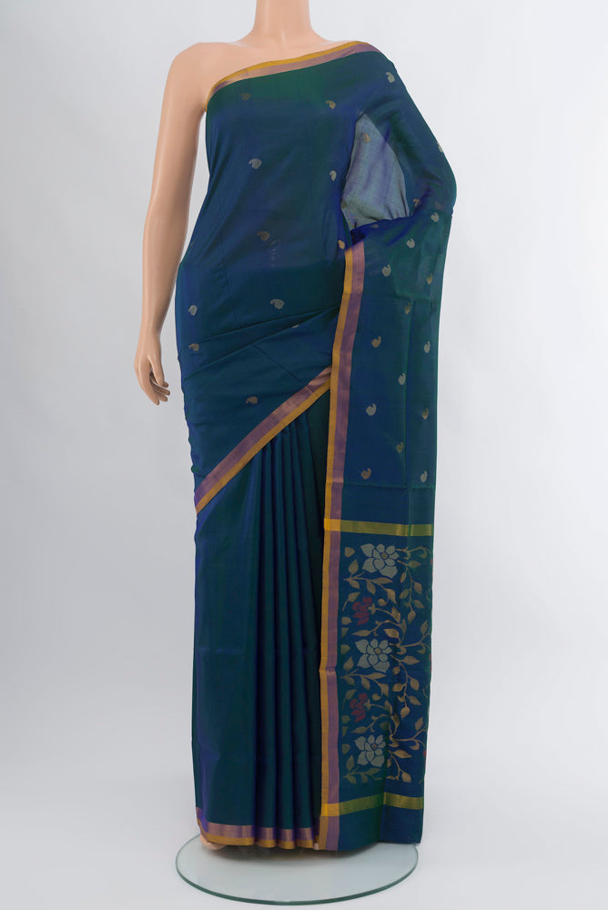 Peacock Blue Uppada Silk Saree with Zari Butta on the body and Silk Border.  displayed on a mannequin