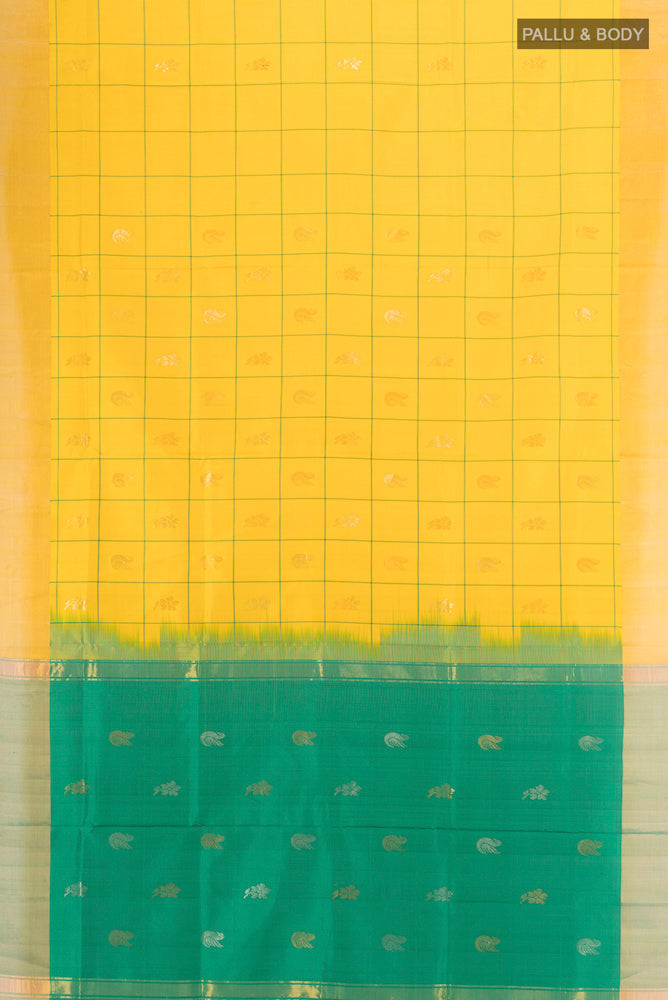 Flat view of Yellow Uppada Silk Saree with Zari Butta on the body and Silk Border. 