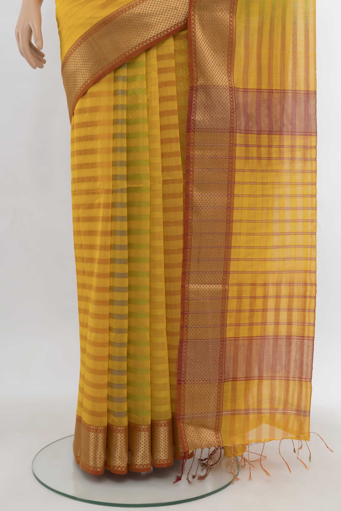 Pleats and pallu of Yellow Maheshwari Silk Cotton Saree with Zari Butta on the body and Silk Border. 