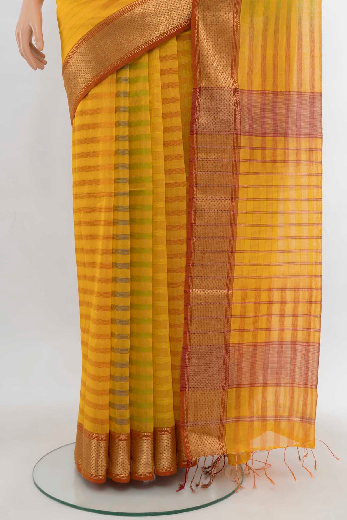 Pleats and pallu of Yellow Maheshwari Silk Cotton Saree with Zari Butta on the body and Silk Border. 