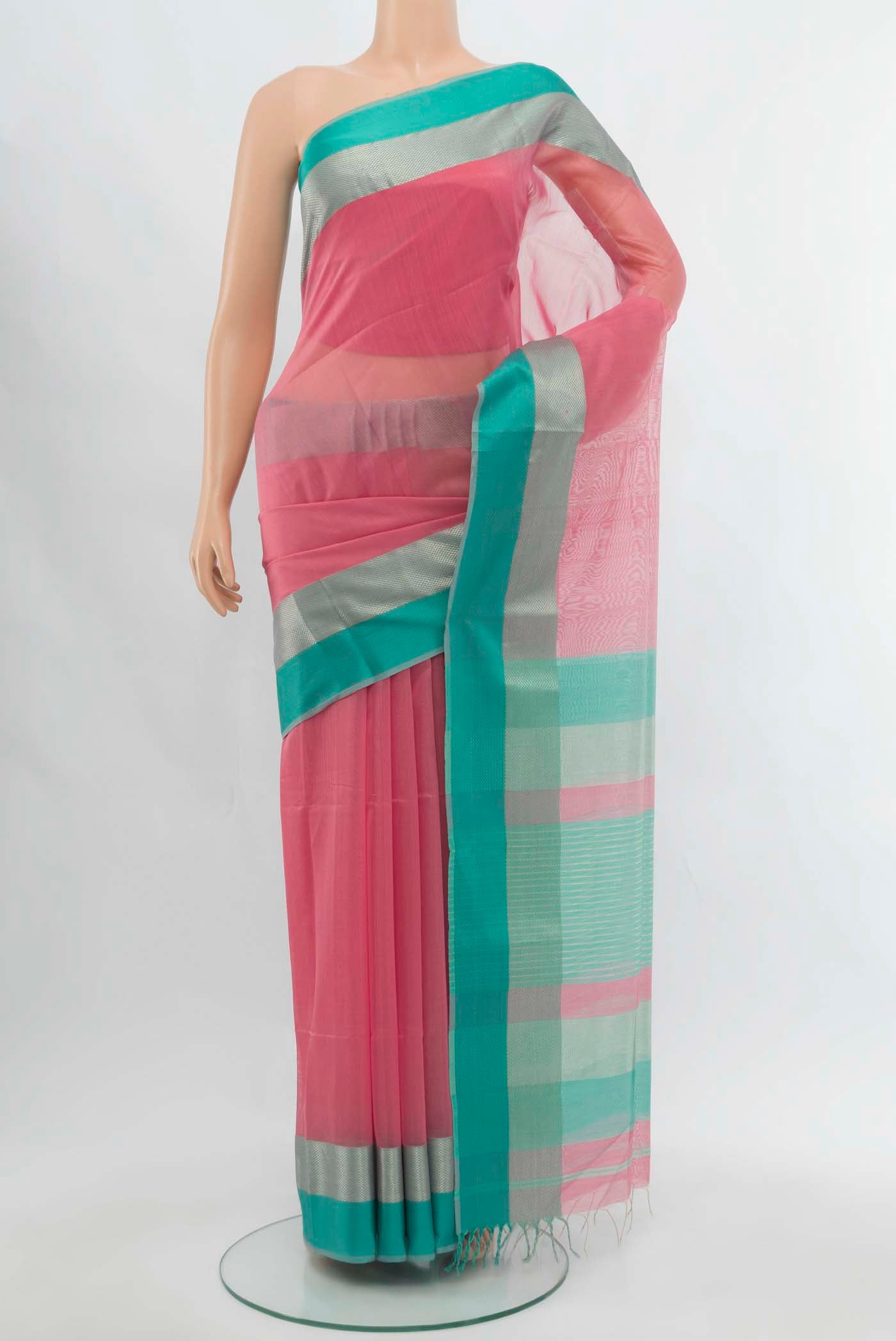 Rose pink Maheshwari Silk Cotton Saree with Plain Body and Satin Border.  displayed on a mannequin
