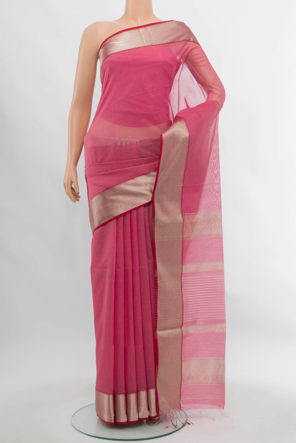 Rose pink Maheshwari Silk Cotton Saree with Plain Body and Silk Border.  displayed on a mannequin