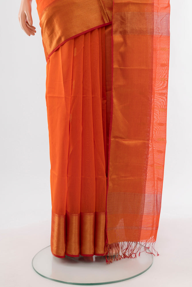 Pleats and pallu of Orange Maheshwari Silk Cotton Saree with Zari Butta on the body and Silk Border. 