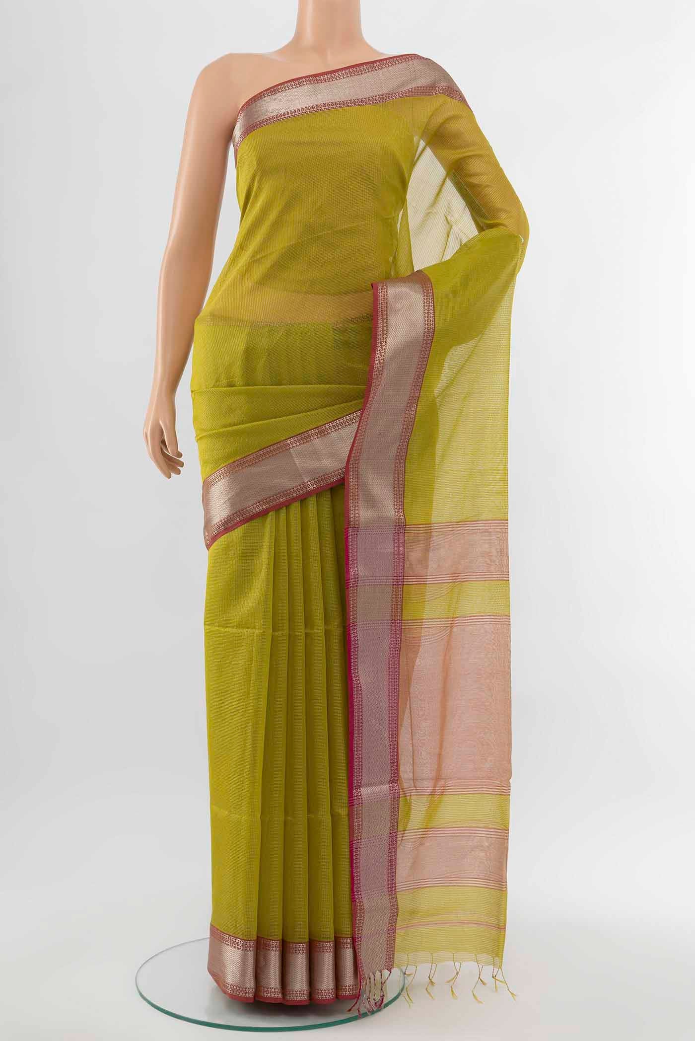 Mehandi Green Maheshwari Silk Cotton Saree with Zari Butta on the body and Silk Border displayed on a mannequin
