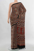 Multi Color Muslin Silk Saree with Floral Print on the body and Silk Border.  displayed on a mannequin