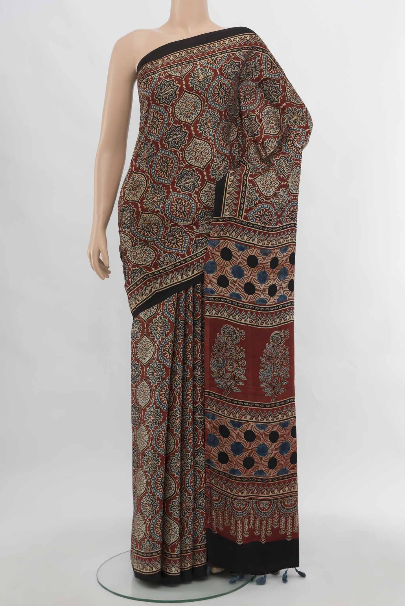 Multi Color Muslin Silk Saree with Floral Print on the body and Silk Border.  displayed on a mannequin