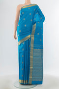 Pure Silk Pure Zari Light Blue Kanjivaram Saree with Zari Butta on the body and Silk Border.  displayed on a mannequin