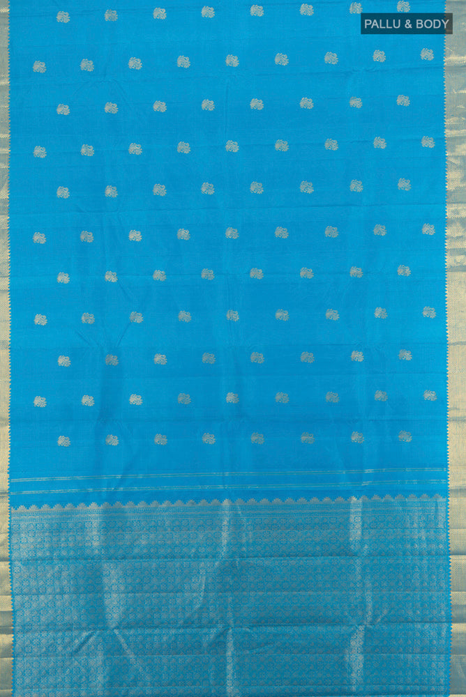 Flat view of Pure Silk Pure Zari Light Blue Kanjivaram Saree with Zari Butta on the body and Silk Border. 