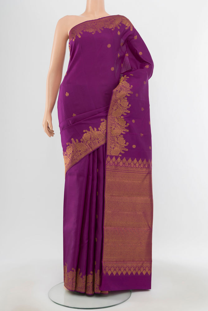Pure Silk Pure Zari Violet Kanjivaram Saree with Zari Butta on the body and Silk Border.  displayed on a mannequin