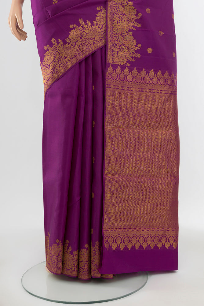 Pleats and pallu of Pure Silk Pure Zari Violet Kanjivaram Saree with Zari Butta on the body and Silk Border. 