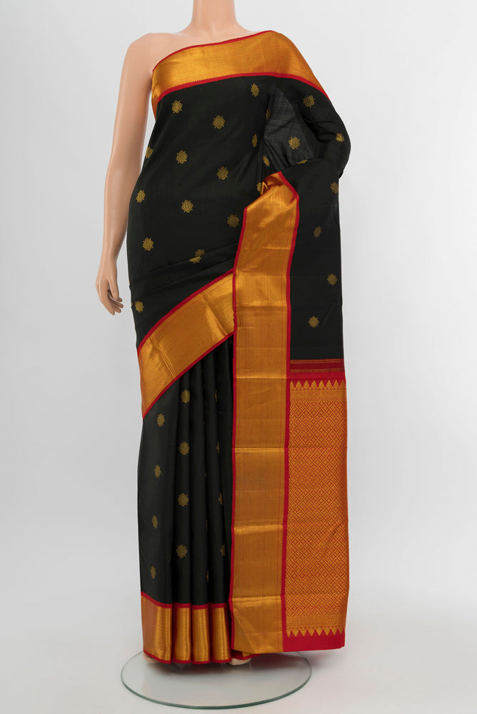 Black Kanjivaram Silk Saree with Zari Butta on the body and Silk Border.  displayed on a mannequin