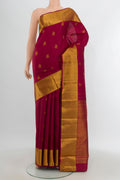 Maroon Kanjivaram Silk Saree with Zari Butta on the body and Zari Border.  displayed on a mannequin