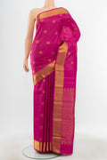 Pure Silk Pure Zari Magenta Kanjivaram Saree with Zari Butta on the body and Silk Border.  displayed on a mannequin