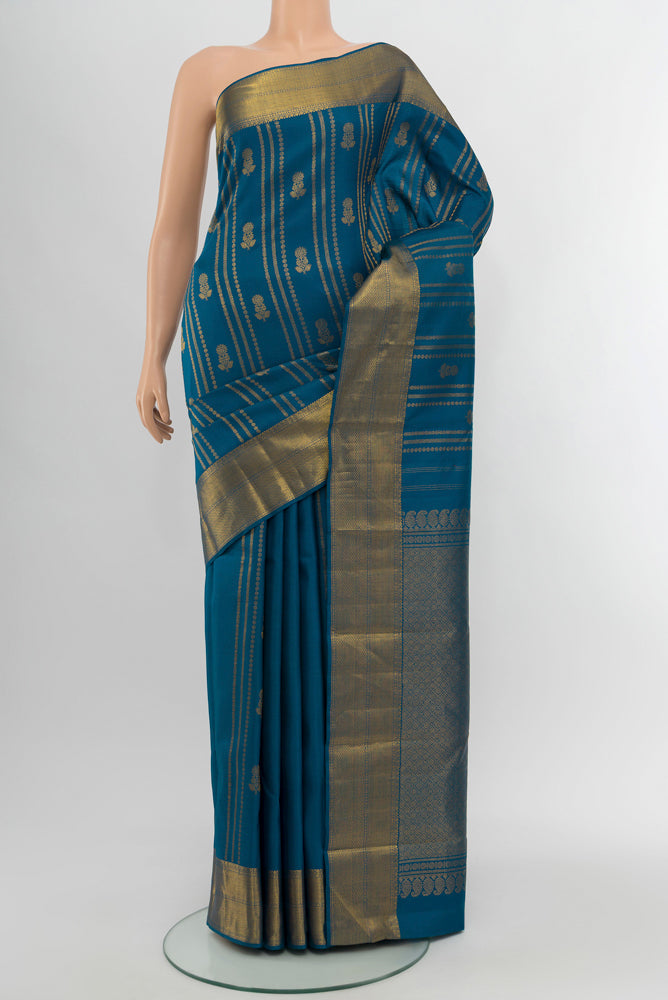 Dark Blue Kanjivaram Silk Saree with Zari Butta on the body and Silk Border.  displayed on a mannequin