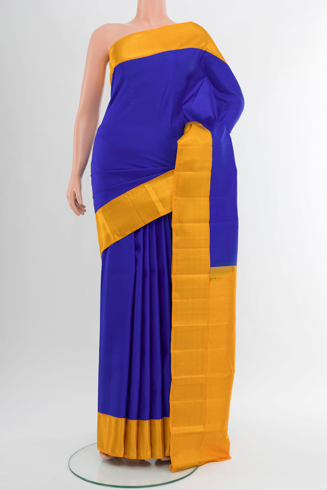 Pure Silk Pure Zari Light Blue Kanchipuram Saree with Zari Butta on the body and Silk Border.  displayed on a mannequin