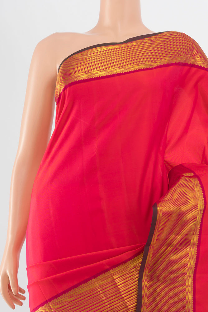 Border image of Peach Kanchipuram Silk Saree with Zari Brocade on the body and Silk Border. 