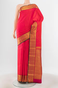 Peach Kanchipuram Silk Saree with Zari Brocade on the body and Silk Border.  displayed on a mannequin
