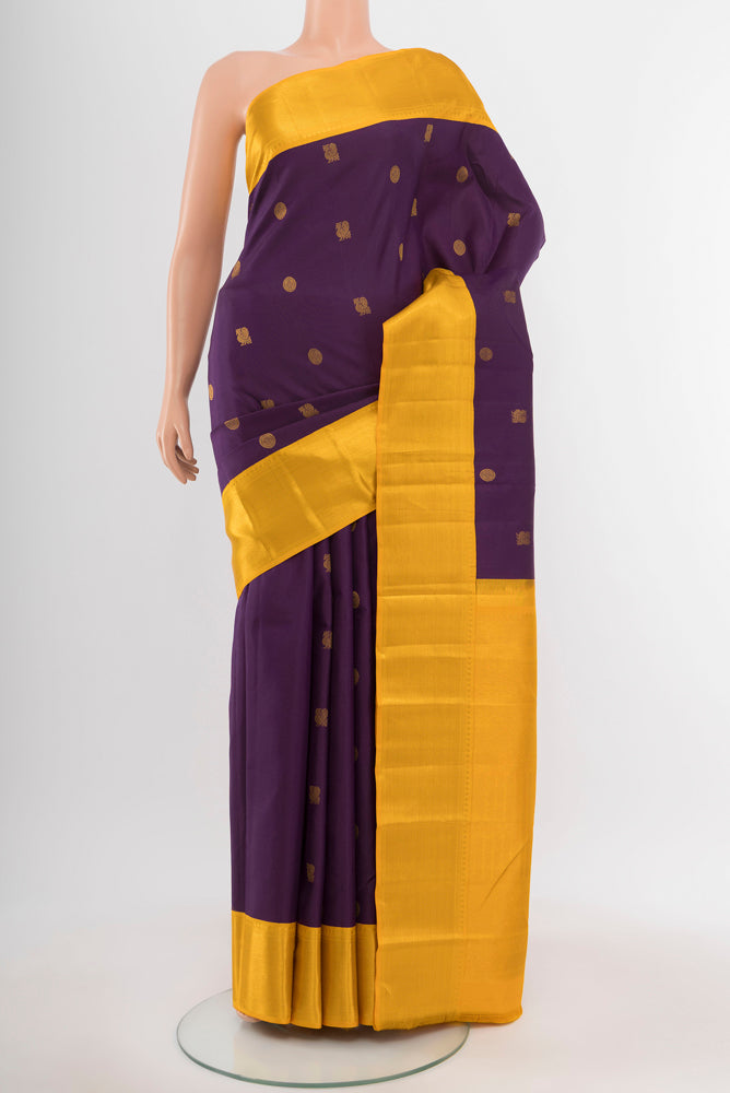 Purple Kanchipuram Silk Saree with Zari Butta on the body and Silk Border.  displayed on a mannequin