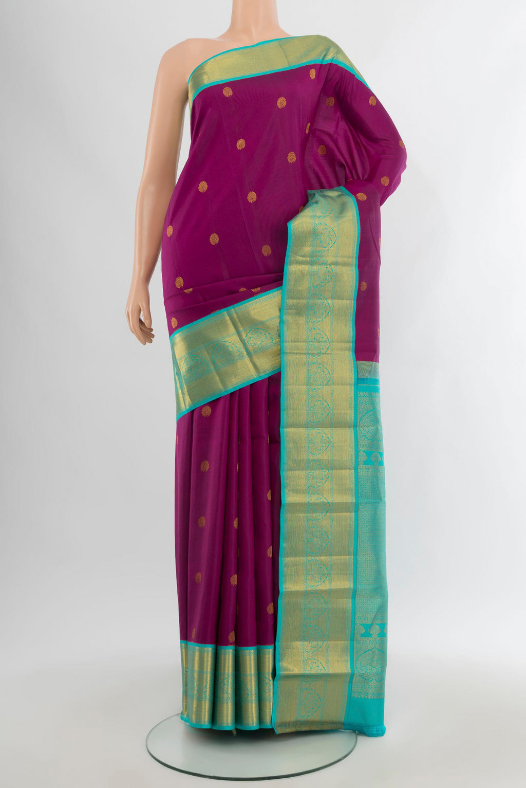 Purple Kanjivaram Silk Saree with Zari Butta on the body and Zari Border.  displayed on a mannequin