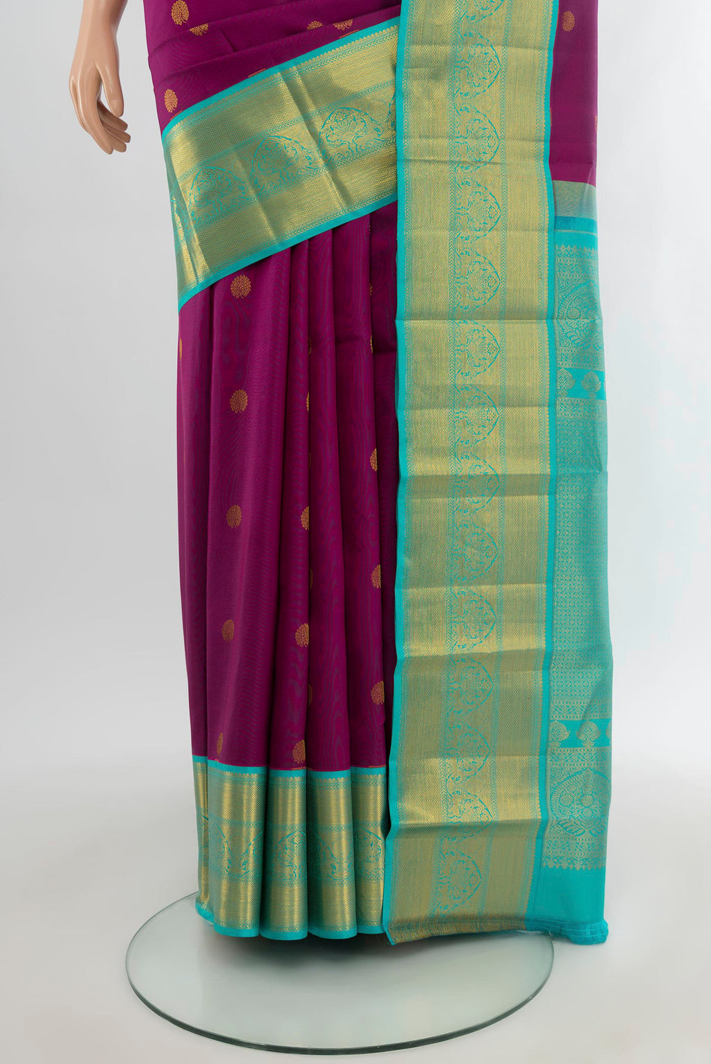 Pleats and pallu of Purple Kanjivaram Silk Saree with Zari Butta on the body and Zari Border. 