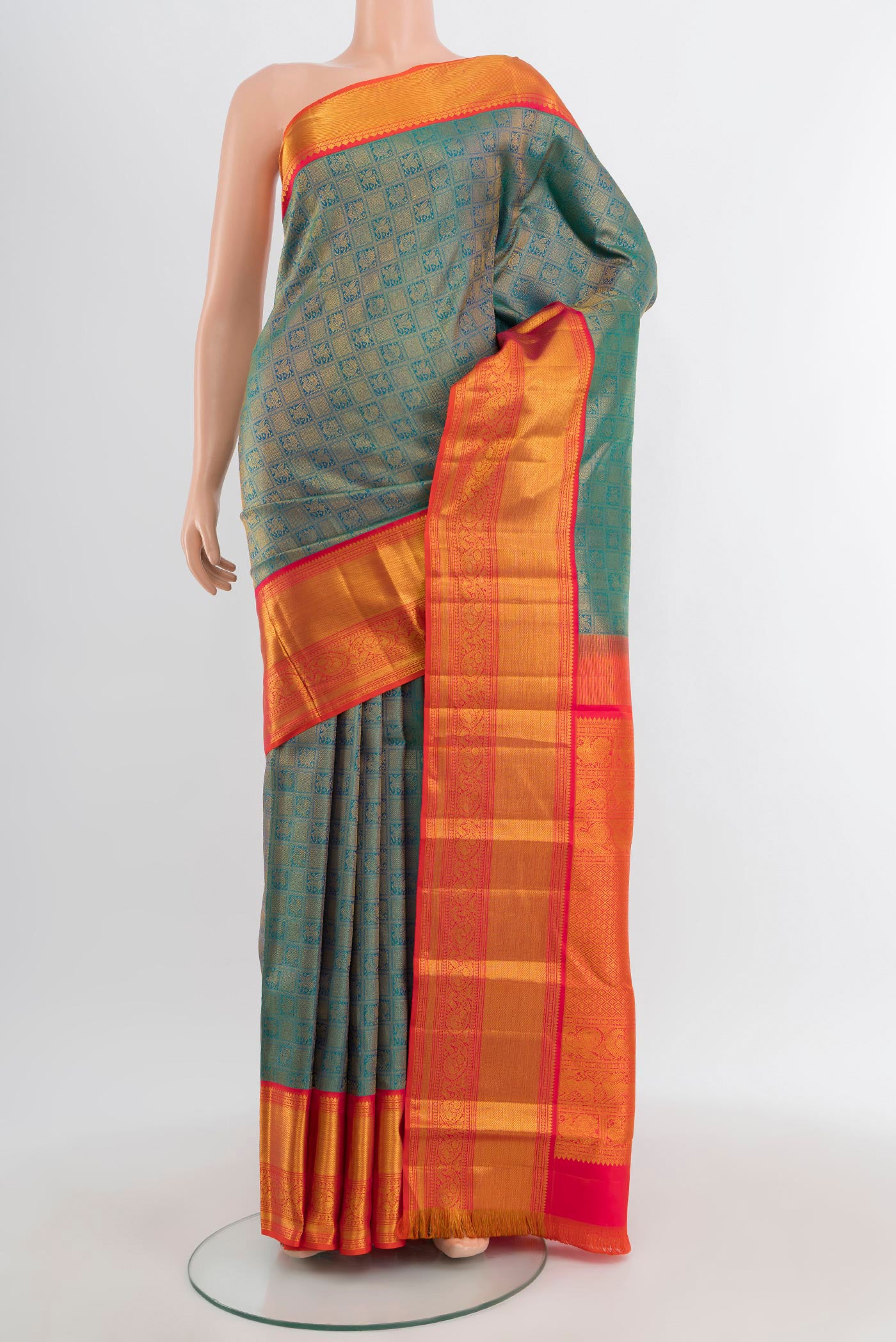 Peacock Blue Kanjivaram Silk Saree with Zari Brocade on the body and Zari Border.  displayed on a mannequin