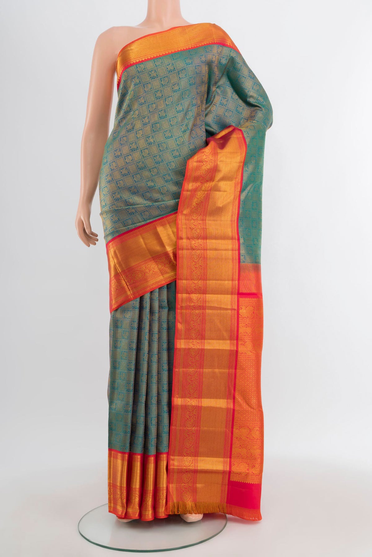Peacock Blue Kanjivaram Silk Saree with Zari Brocade on the body and Zari Border.  displayed on a mannequin
