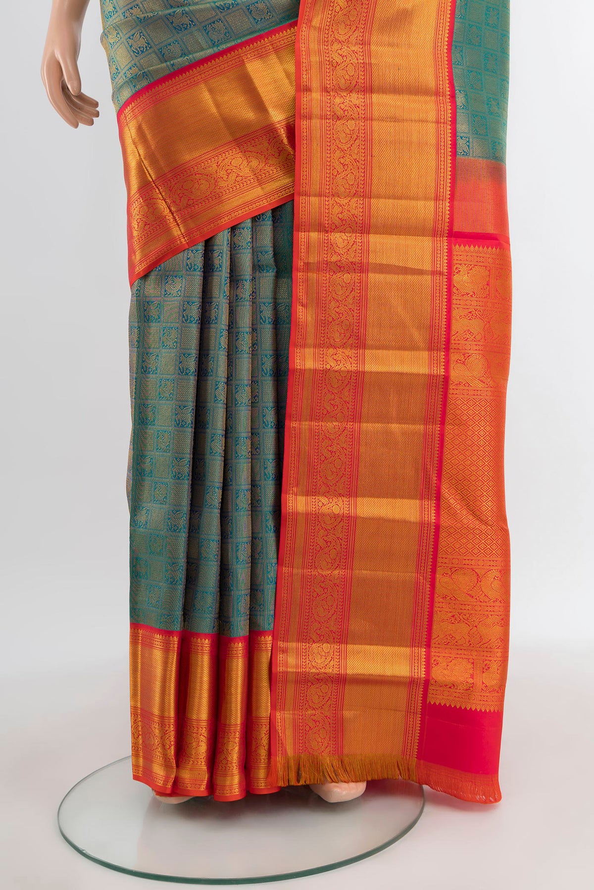 Pleats and pallu of Peacock Blue Kanjivaram Silk Saree with Zari Brocade on the body and Zari Border. 