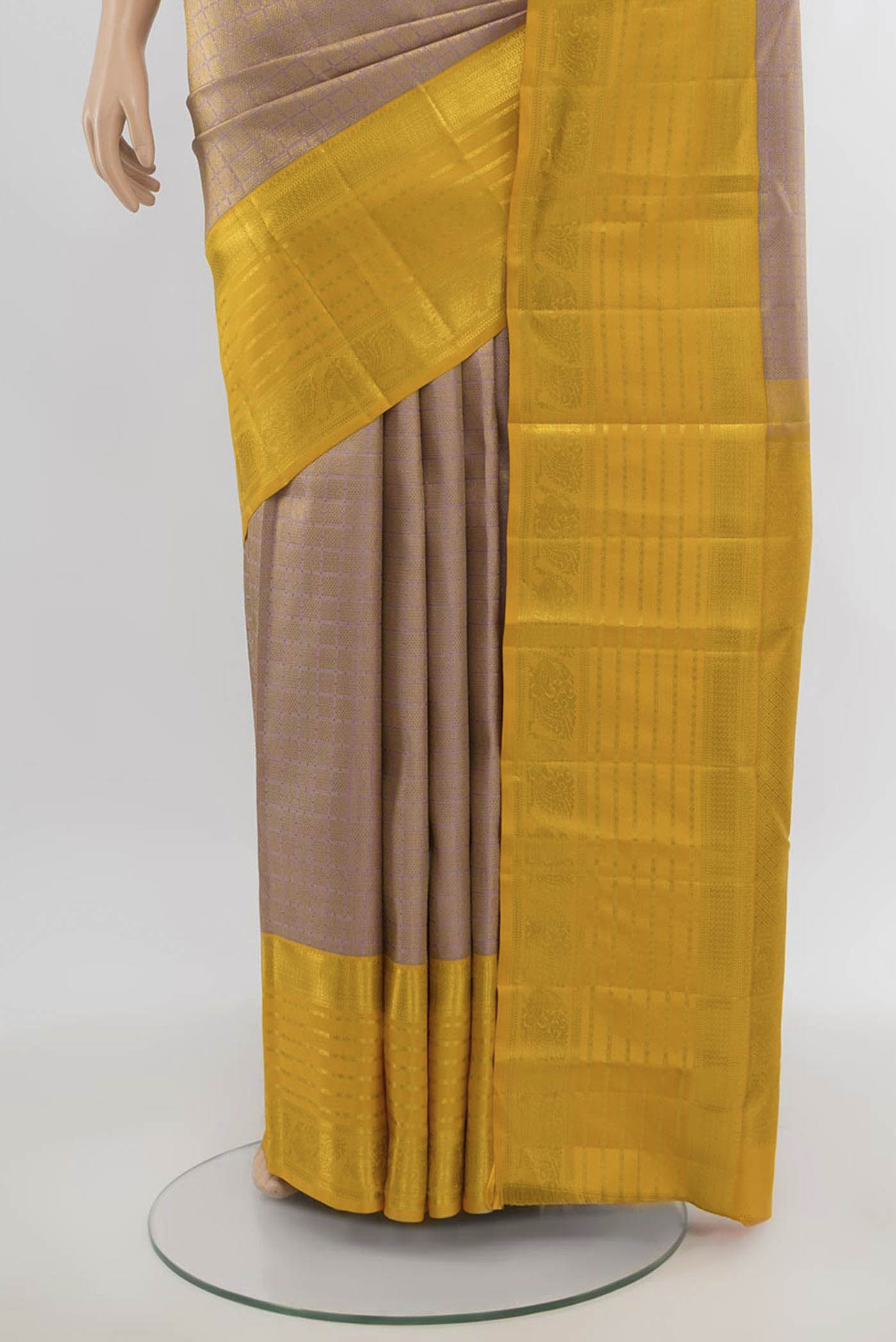 Pleats and pallu of Golden Kanjivaram Silk Saree with Zari Butta on the body and Silk Border. 