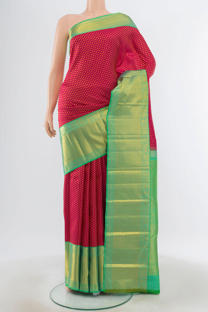 Dark Pink Kanjivaram Silk Saree with Plain Body and Silk Border.  displayed on a mannequin